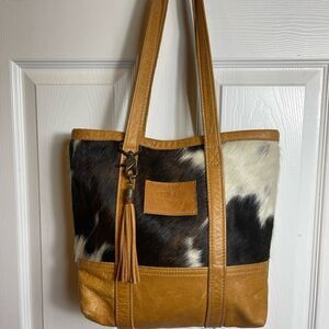 Canoe Hand made in the USA Cowhide shoulder bag with tassel accent